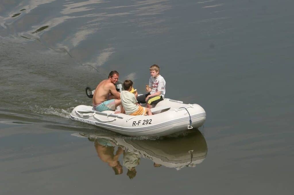Men with young boys in Dinghy