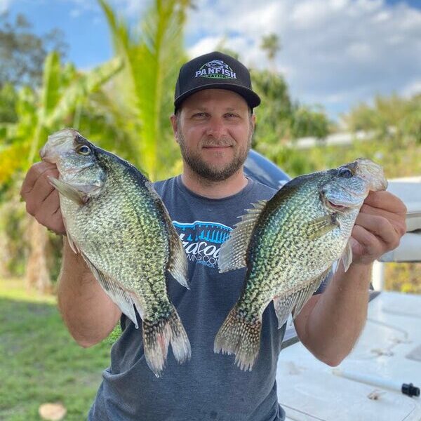 Adam (site owner) holding two large black crappie